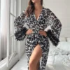 cheetah print stylish net gown with feather lace on sleeves